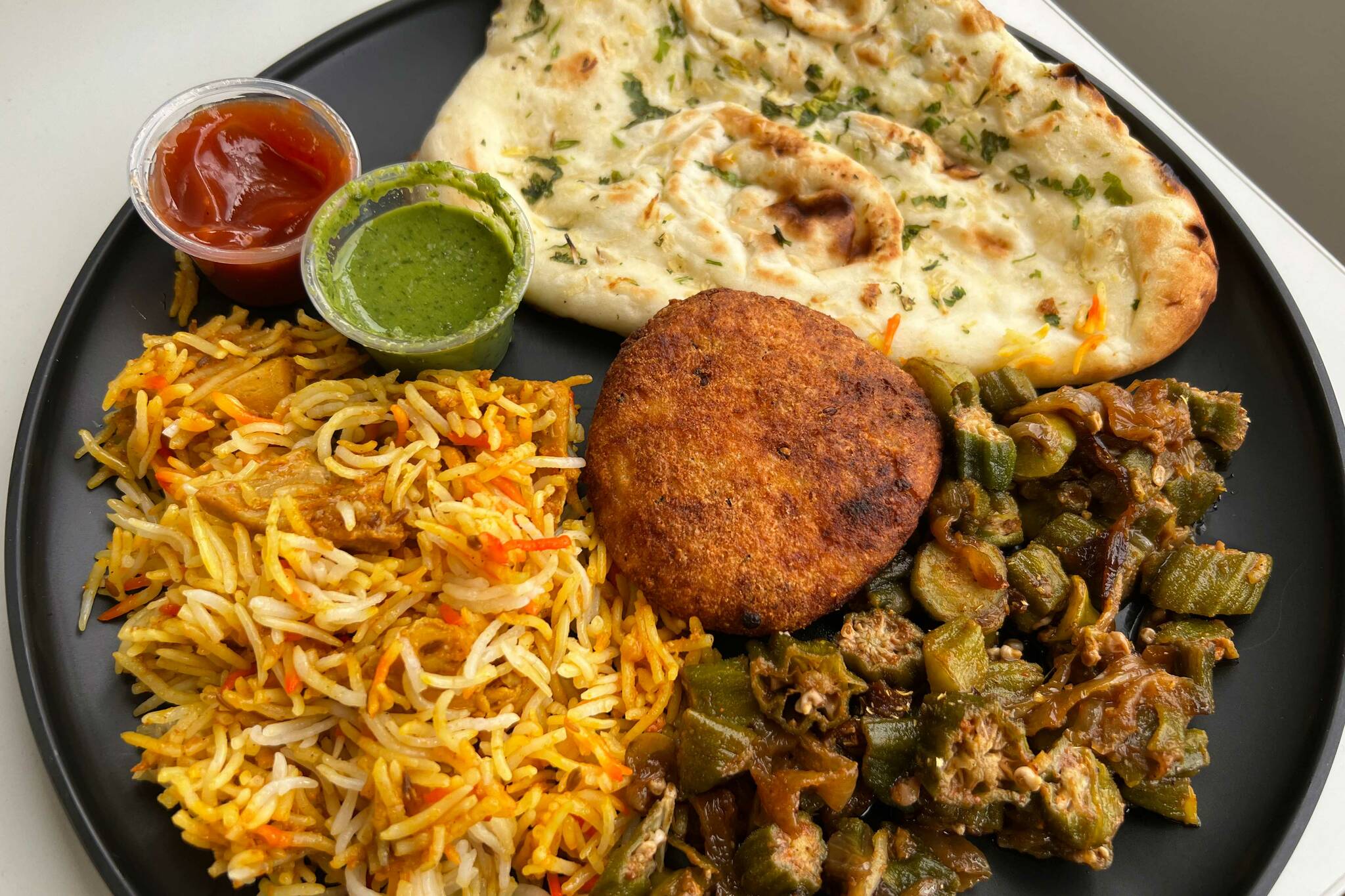 Garlic Naan, Paneer Kebab, Biryani Chicken and Bhindi Masala from Rice-N-Curry (Photo by Cameron Sheppard/Alb Media)