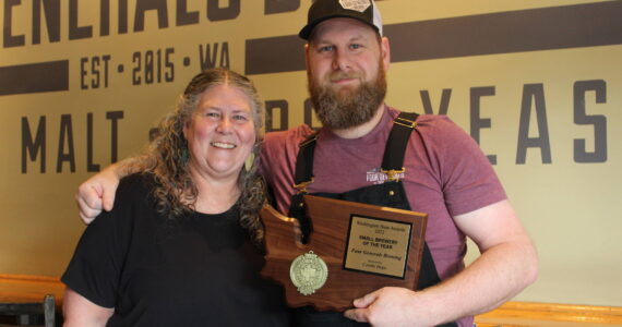 Four Generals co-owners and mother and son Mary Hudspeth and Ross Hudspeth pose with their “Small Brewery of the Year” plaque. Bailey Jo Josie / Renton News