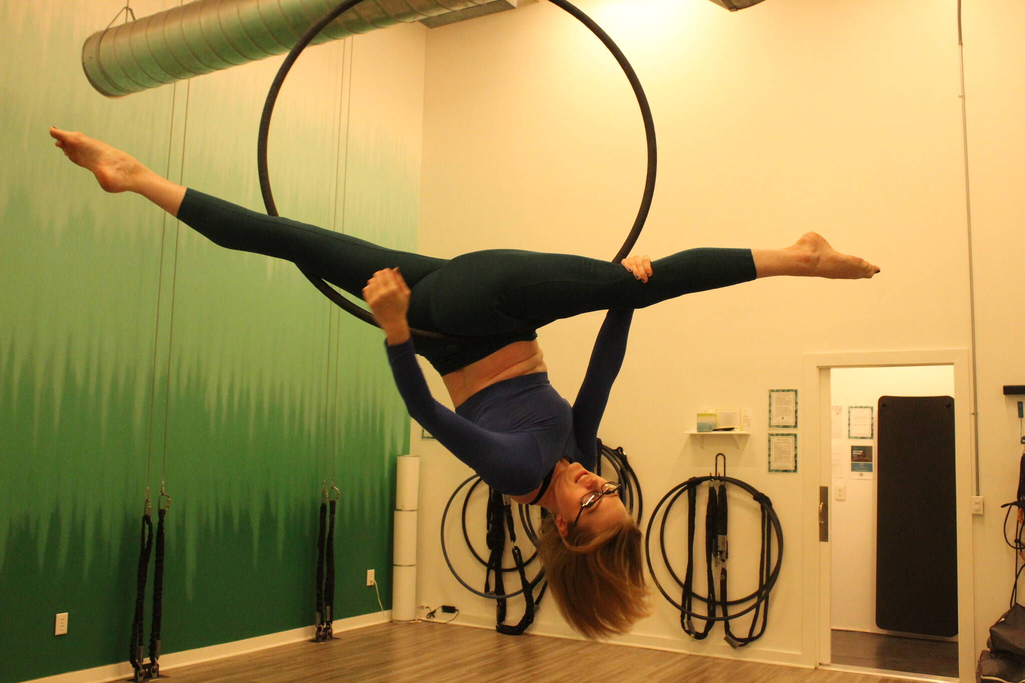 Maggie Nation shows her favorite aerial pose on the lyra - the Jade Split. Photo by Bailey Jo Josie/Alb Media.