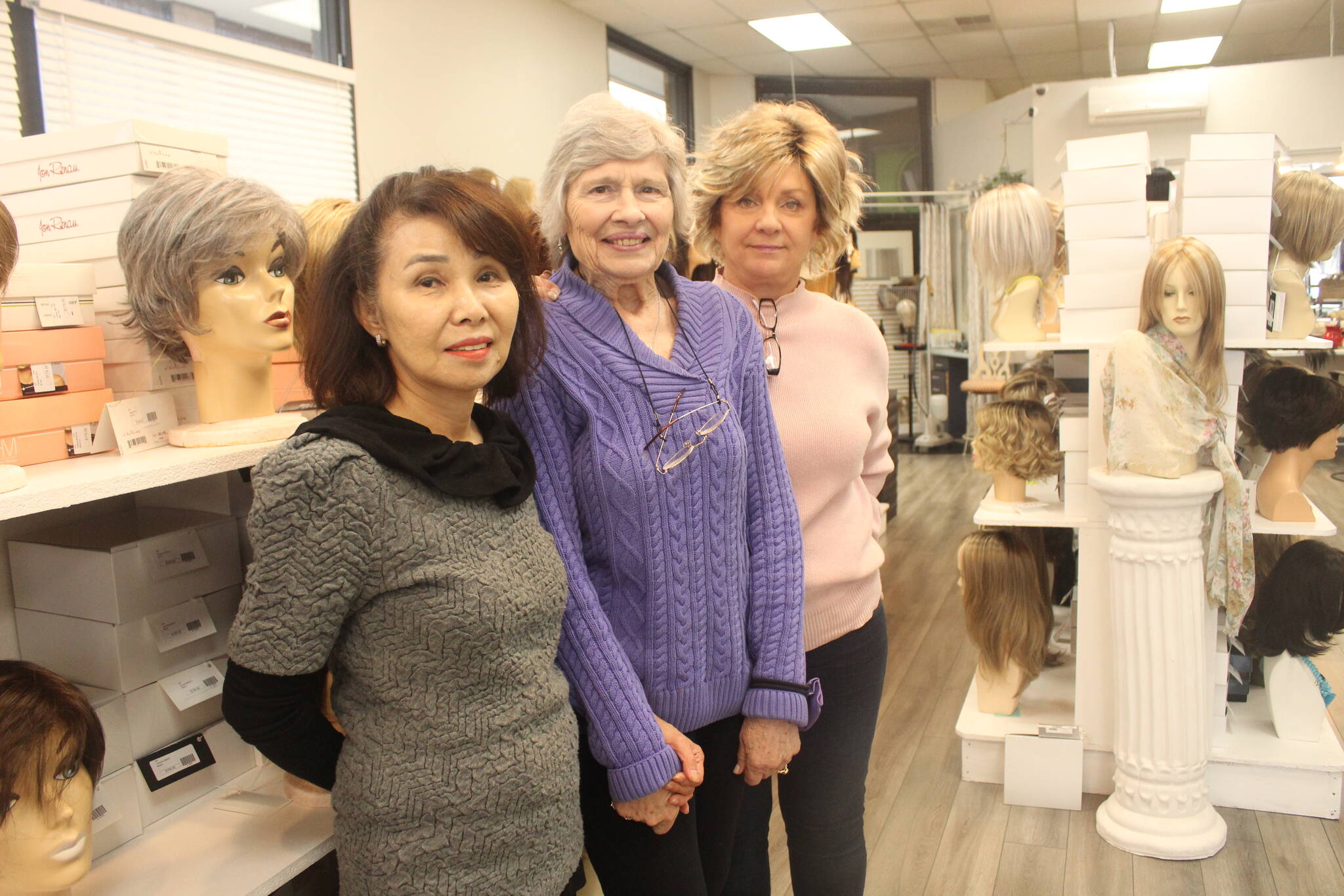 June Paik (left) and her employees at Master Hair Care can work with clients for hours to find the perfect wig or hair piece. Photo by Bailey Jo Josie/Alb Media.