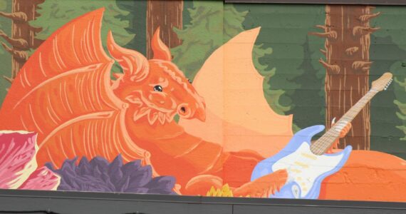 A mural of a dragon playing guitar in downtown Renton. Photo by Bailey Jo Josie / Renton News