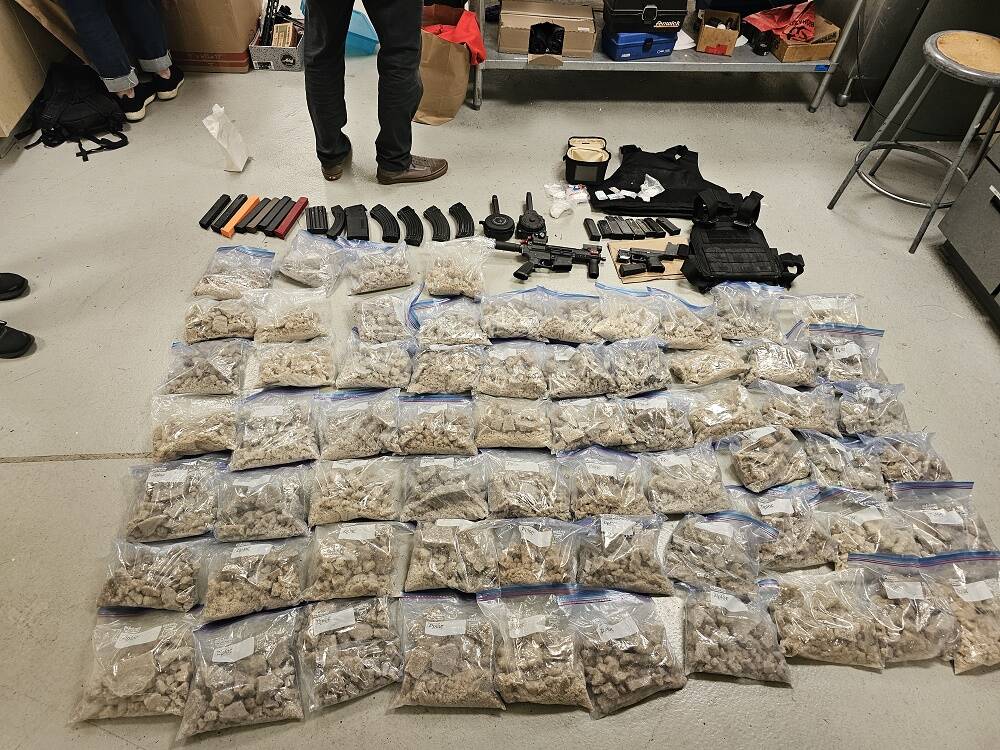 Police found a firearm and firearms parts, ammunition, body armor, more than 134 pounds of MDMA, more than 2,300 fentanyl pills, and more in a 33-year-old Auburn man’s apartment while executing a search warrant. (Courtesy of the U.S. Department of Justice)