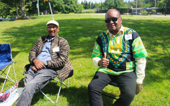 Volunteers enjoy the sunshine at Renton’s 2024 Juneteenth Celebration. The weather will be sunny this weekend as summer officially starts. Photo by Bailey Jo Josie/Alb Media