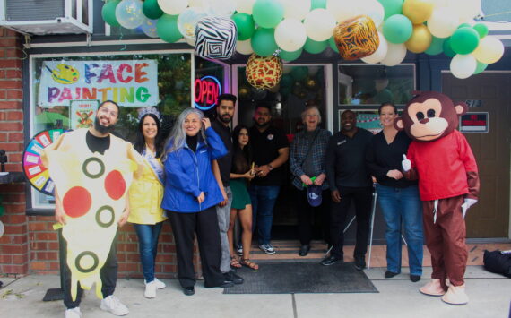 The Renton Chamber of Commerce and Renton City Council members celebrate Smoking Monkey Pizza’s 10-year celebration. Photo by Bailey Jo Josie/Alb Media.